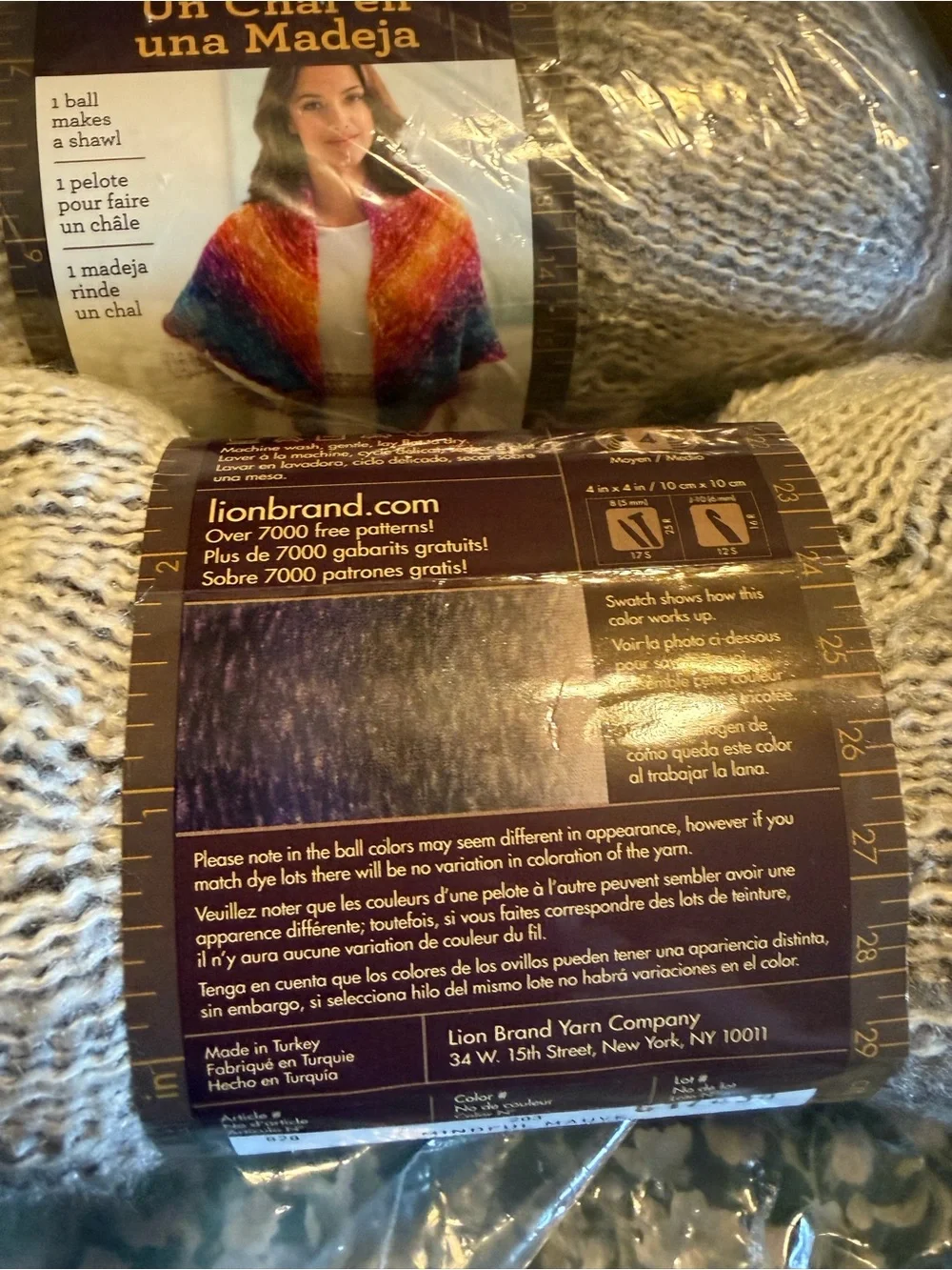 Lion brand shawl in a ball in mindful mauve, two balls new in plastic.